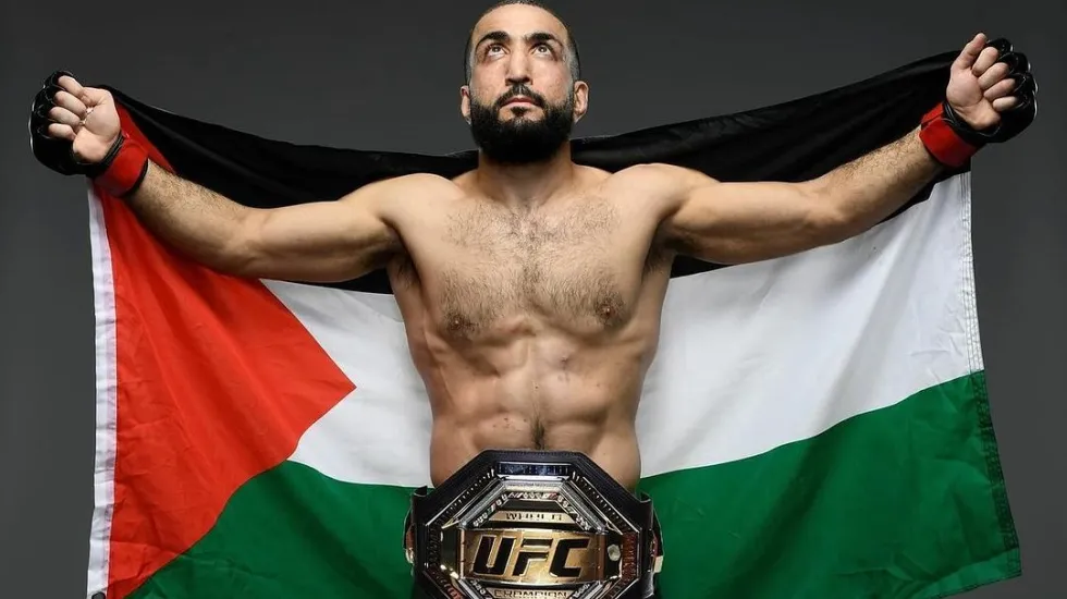 Belal Muhammad holding Palestinian flag during the weigh-ins