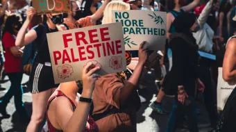 A Person Holding a Poster saying &quot;Free Palestine&quot;